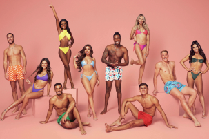 Love Island S7 cast photo with contestants smiling in swimwear 