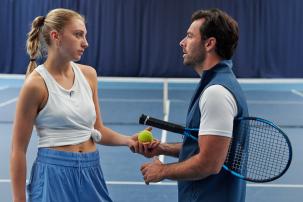 boy and girl playing tennis