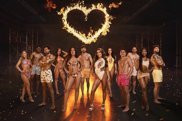 The Love Island cast in front of a flaming heart of fire